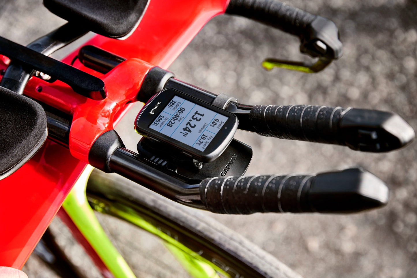 Garmin Charge Power Pack black mounted on a red bike handlebar with Garmin GPS device