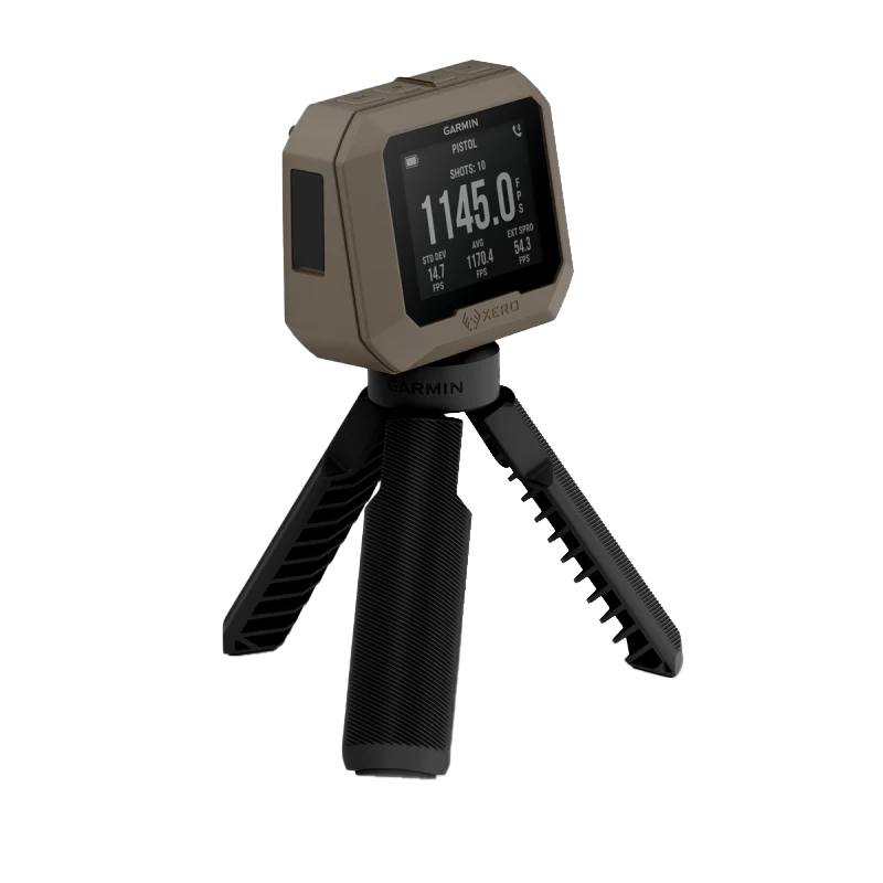 Garmin Xero C1 Pro firearm and archery chronograph on a black tripod, tan unit with Garmin logo