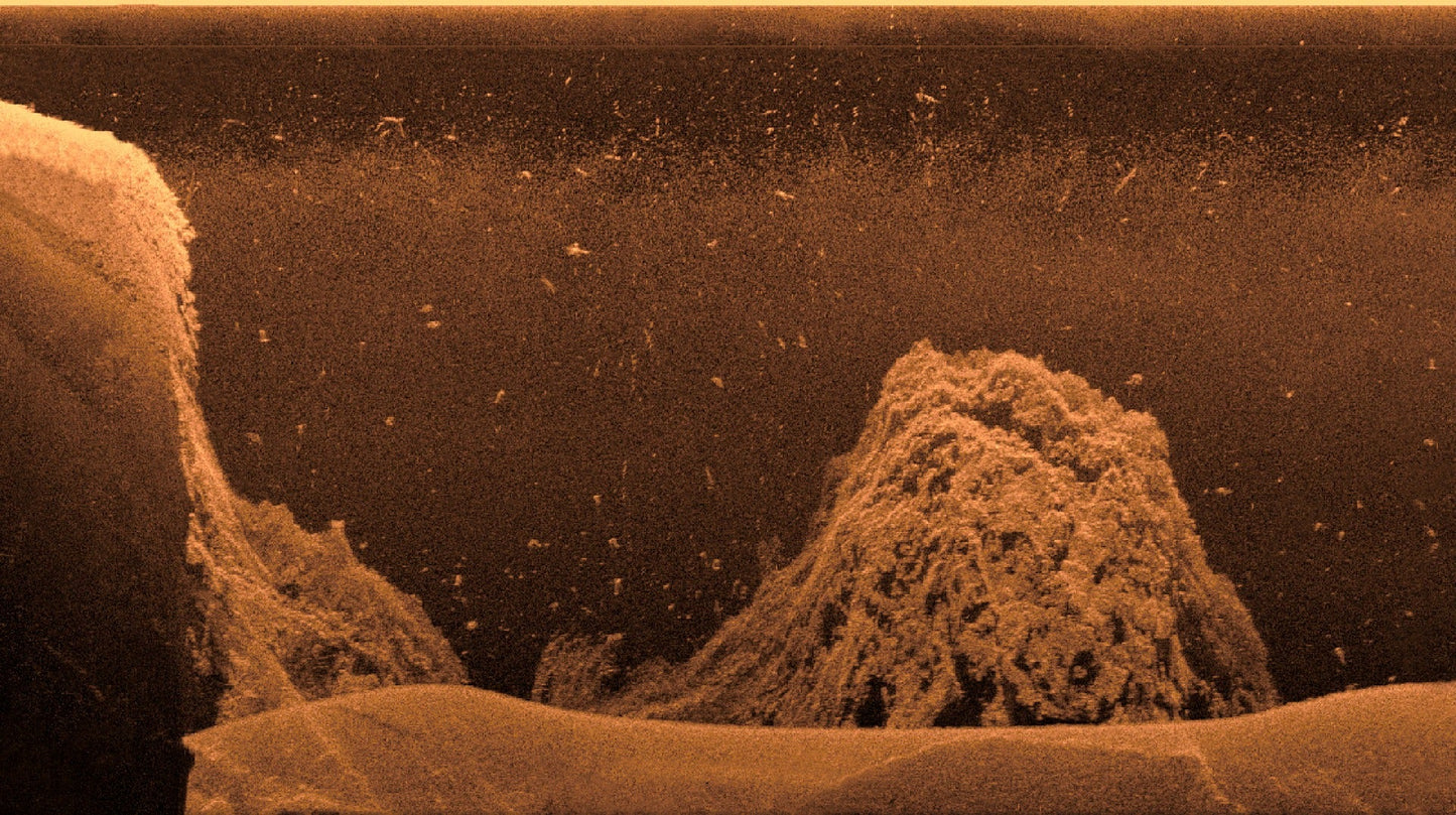 Garmin Ultra HD Scanning Sonar System orange-toned underwater sonar image showing rocky seabed