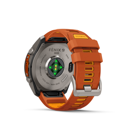 Garmin Fenix 9 Pro AMOLED smartwatch with 51mm titanium case and orange silicone strap, back view.
