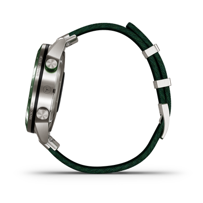 Garmin MARQ Golfer Gen1 smartwatch with stainless steel case and green braided strap.