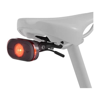 Garmin Varia eRTL615 radar tail light for eBikes; red lens, clip-on mount attached to bike saddle.